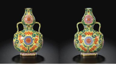 AN EXQUISITE PAIR OF YELLOW GROUND FAMILLE-ROSE DOUBLE-GOURD VASES
SEAL MARKS AND PERIOD OF QIANLONG